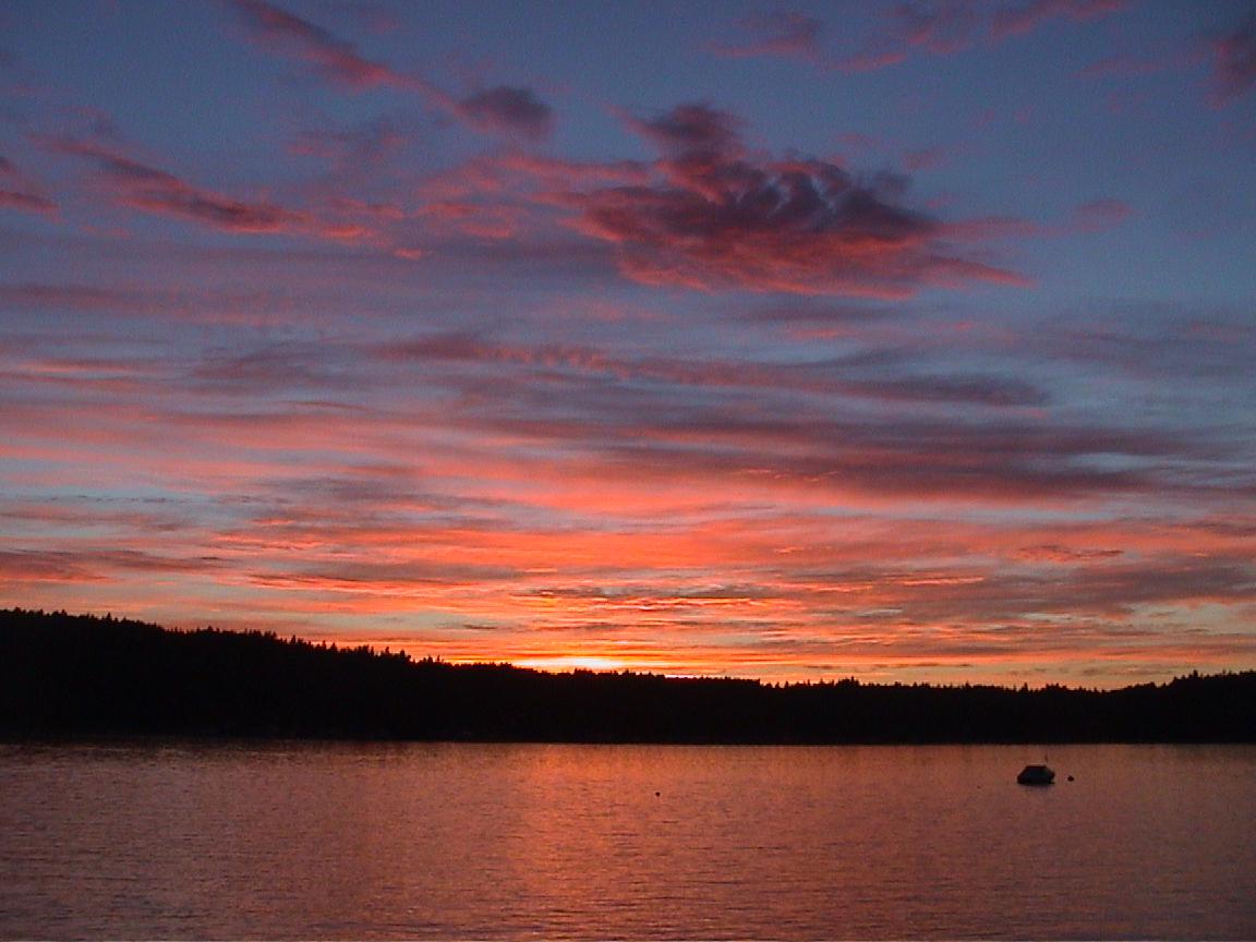 Sunset over Quartermaster Harbor, Vashon Island, Washington by R. Bornn